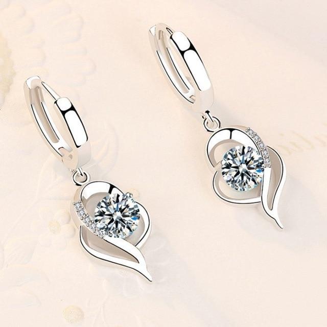 Boucles d'oreilles florales finition argent et zirconium