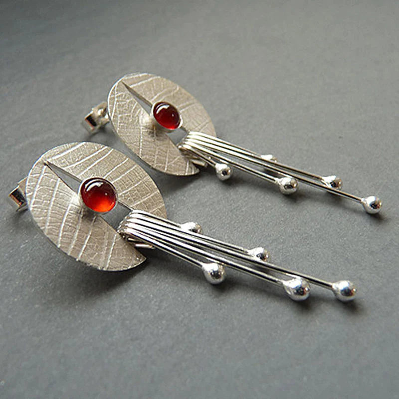 Boucles d'oreilles avec cristal rouge