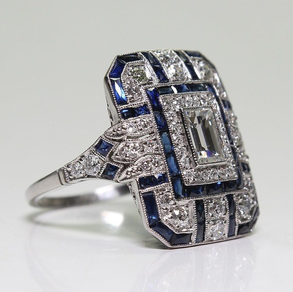 Bague vintage argentée brillante et zirconium bleu
