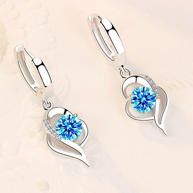 Boucles d'oreilles florales finition argent et zirconium